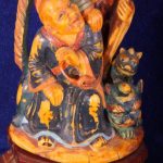 Close up of two men Ivory Carving